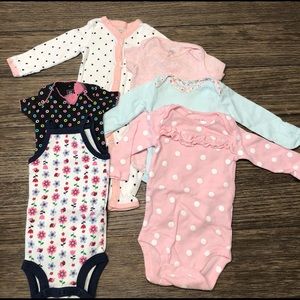 Set of onesies. All newborn sized. Great condition
